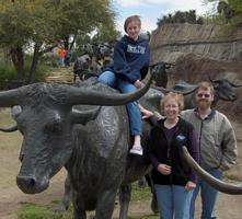 Photo of Sara, Sandi and Jerry with "cattle" in Dallas